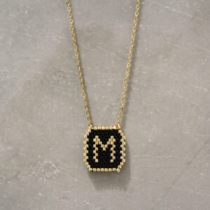 Black and Gold M Pendant